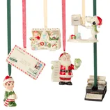 Five Christmas ornaments: a letter to Santa, a typewriter, Santa with a list, a toy box, and a dog by a mailbox. Each is personalized with names or themes related to the holiday season.