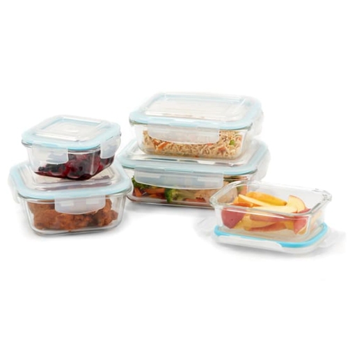 A 5-piece glass food container set with clear, rectangular containers of varying sizes, each with light blue airtight lids. They contain different foods like fruits, noodles, and meats.