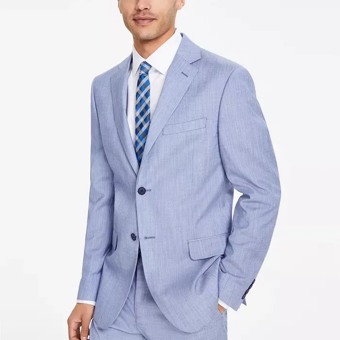 A light blue, modern-fit DKNY suit jacket with a subtle pinstripe pattern, featuring a notched lapel and front flap pockets, paired with a striped tie.