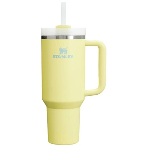 A yellow Stanley travel mug with a handle, featuring a straw and lid.