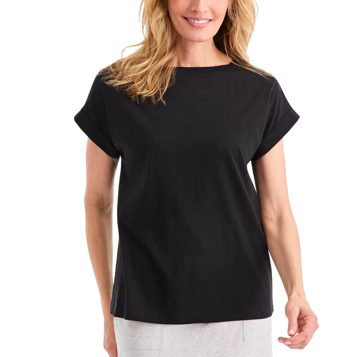 A woman is wearing a plain black short-sleeve t-shirt paired with light gray pants.