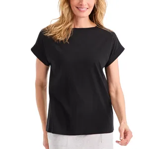 A woman is wearing a plain black short-sleeve t-shirt paired with light gray pants.