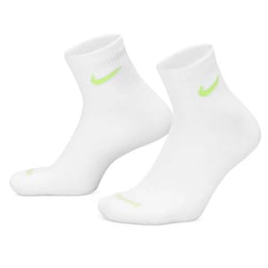 A pair of white ankle socks with a neon green swoosh logo near the cuffs.