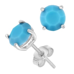 Silver stud earrings featuring round blue gemstones in a prong setting.