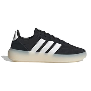 A black and white sneaker with three white stripes on the side, featuring a translucent, chunky sole.