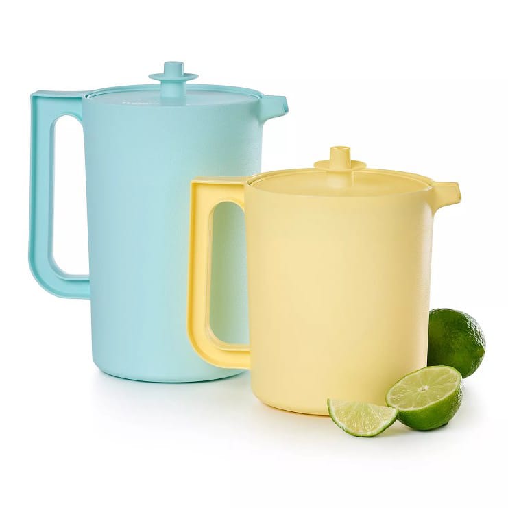 Two sleek, modern plastic pitchers in pastel blue and yellow, accompanied by halved limes.