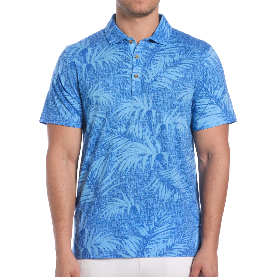 Blue polo shirt with a pattern of palm leaves, buttoned collar, and short sleeves.