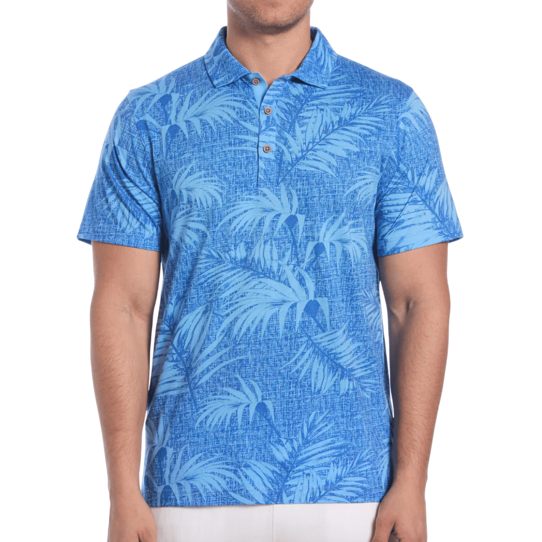 Blue polo shirt with a pattern of palm leaves, buttoned collar, and short sleeves.