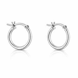 A pair of small silver hoop earrings with a hinge clasp design suitable for piercings.