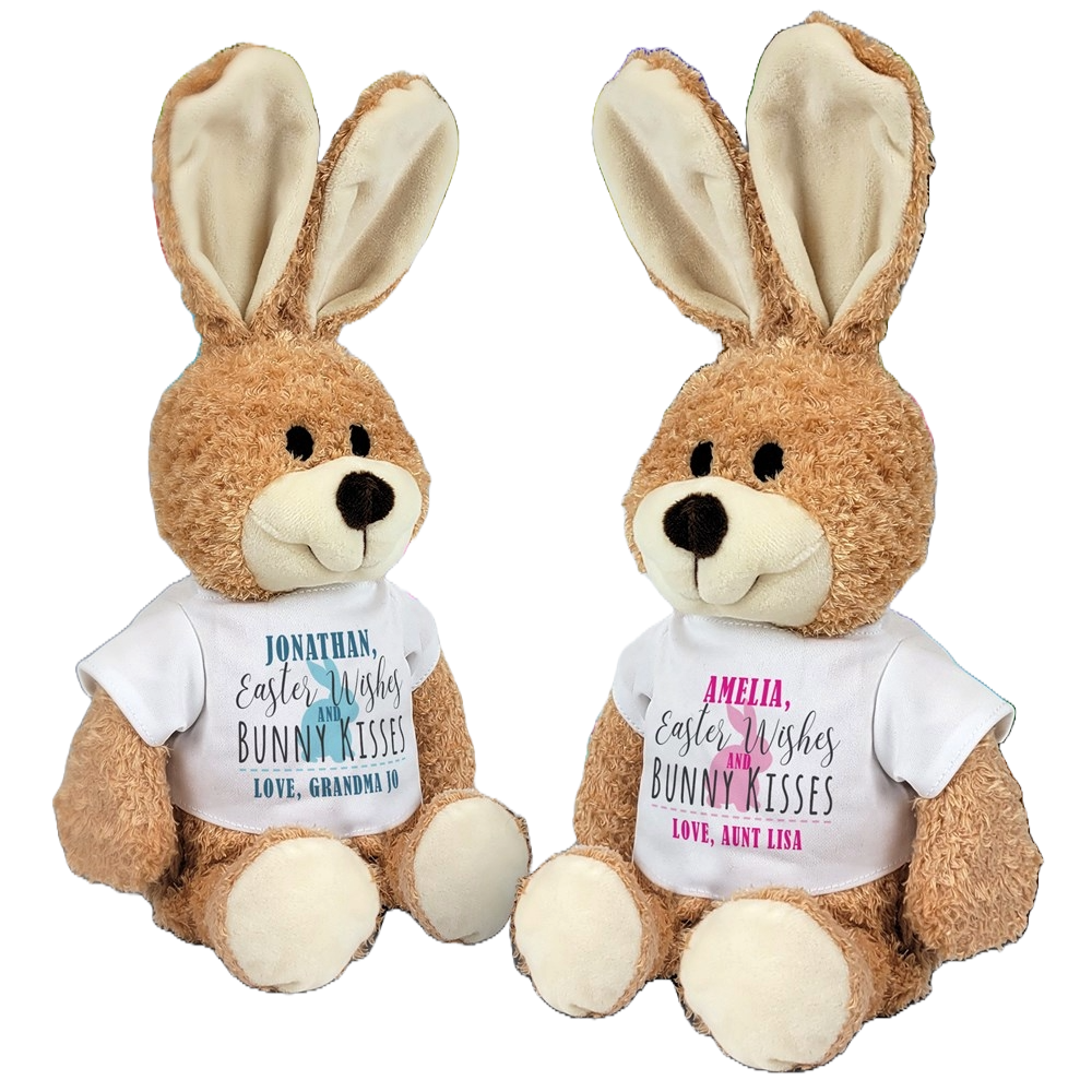 Two plush bunnies with oversized ears, each wearing a personalized white shirt. The shirts have festive messages with the names \“Jonathan\“ and \“Amelia\“ along with sender names \“Grandma Jo\“ and \“Aunt Lisa.\“