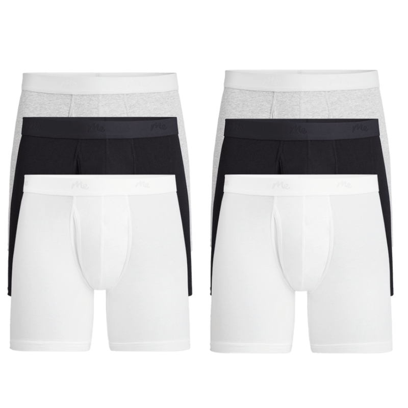 A 6-pack of MeUndies boxer briefs featuring two pairs each in white, black, and light gray. Each pair has a waistband with a subtle \“Me\“ branding.