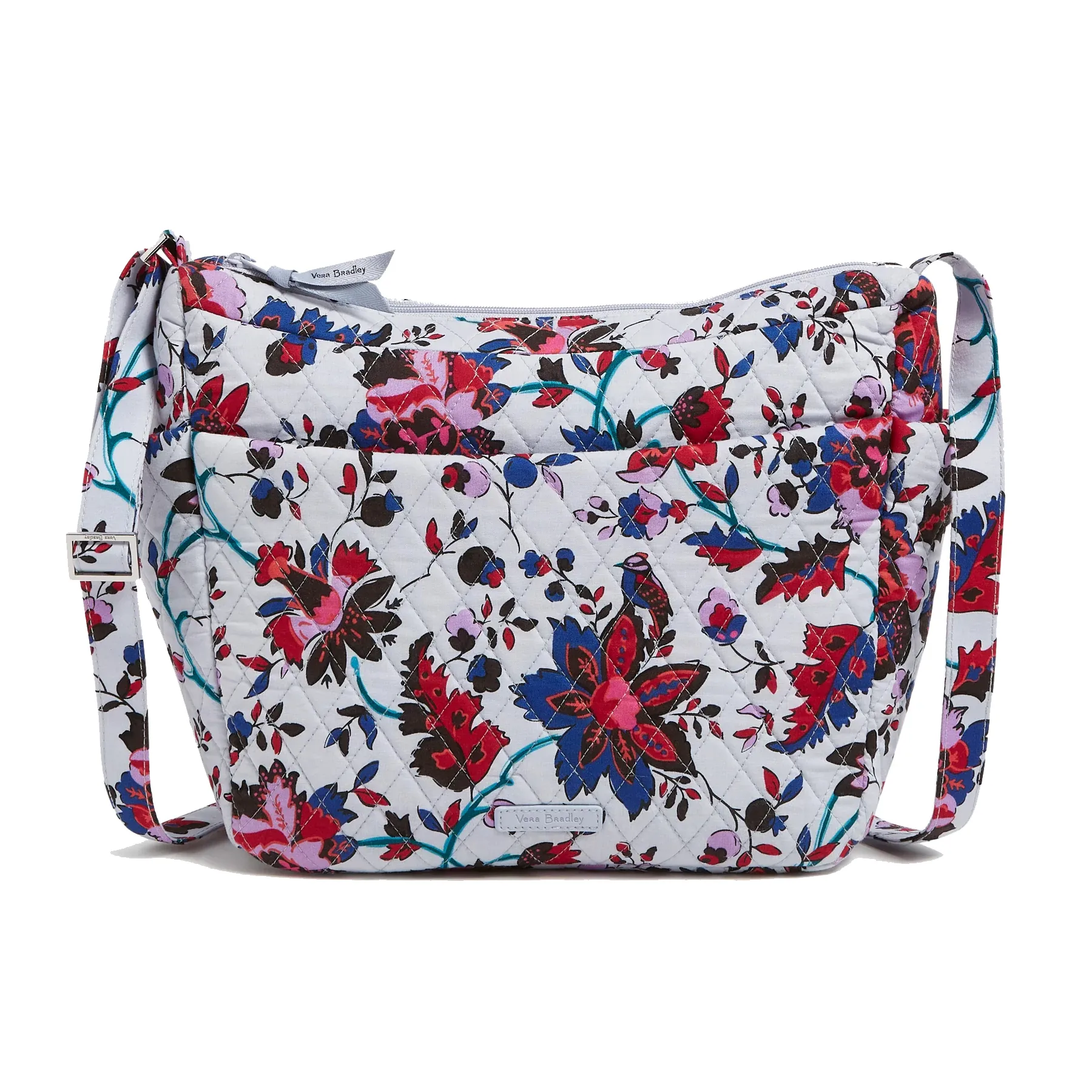A quilted shoulder bag with a floral pattern featuring red, blue, pink, and black colors on a white background. It has an adjustable strap and a spacious design, suitable for everyday use.