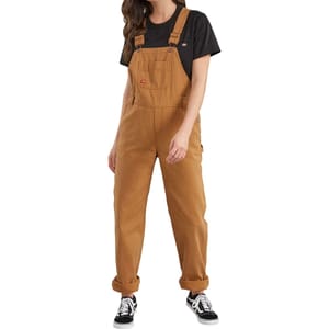 Brown, relaxed-fit overalls for women by Dickies with adjustable straps, a chest pocket, and side button closures. Paired with a black t-shirt and black sneakers.