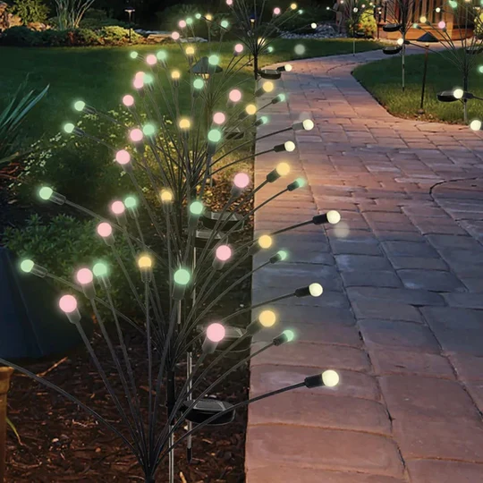 Outdoor path lights featuring multicolored LED bulbs on thin, flexible stems, creating a decorative and colorful display along a garden pathway.