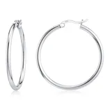 Silver hoop earrings with a latch back design, marked with \“925\“ indicating sterling silver.