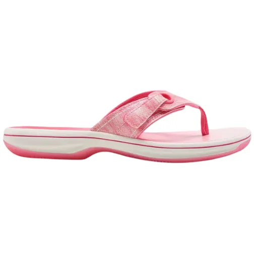 A pink thong sandal with a cushioned sole and adjustable strap, featuring a white midsole and pink outsole.