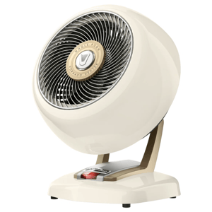 A vintage-style cream tabletop fan with a round body, metal grille, and adjustable base designed for whole-room air circulation.