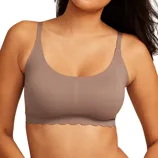 A seamless taupe bralette with scalloped edges and adjustable straps.