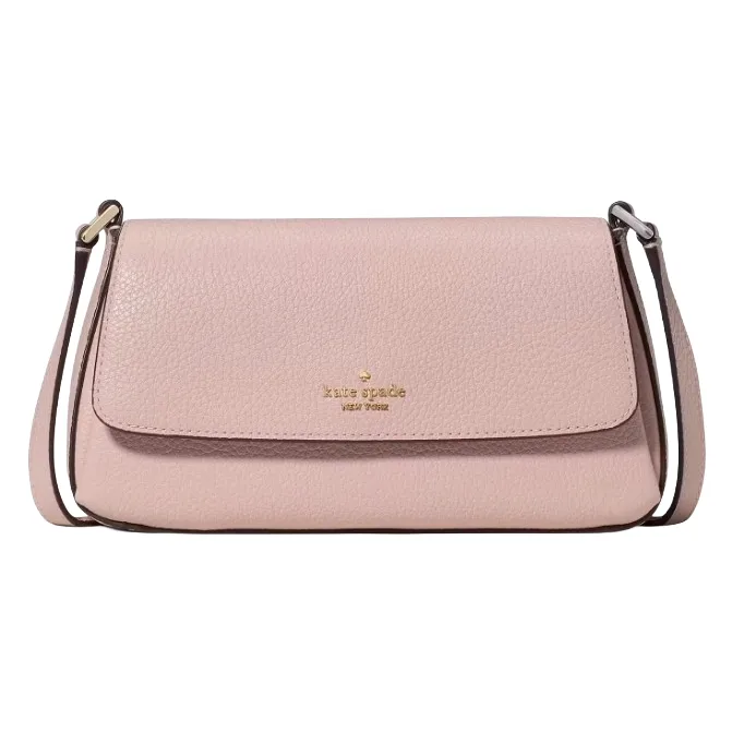 A pink, pebble-leather crossbody bag with a front flap and a strap, featuring the \“kate spade new york\“ logo in gold lettering.