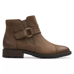 Brown leather ankle boot with a low block heel, strap detail, and side stitching.