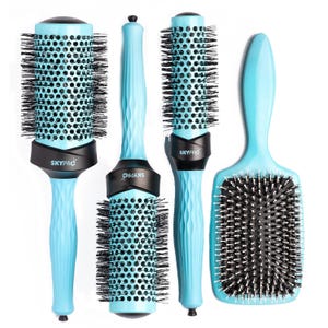 A set of four light blue hairbrushes with black bristles, including three round brushes of varying sizes and one paddle brush.