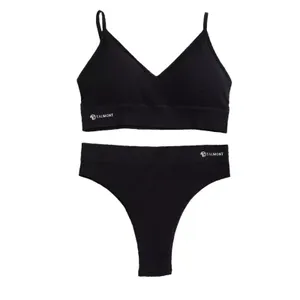 A black bralette and thong set with the brand name \“TALMONT\“ printed on both pieces.