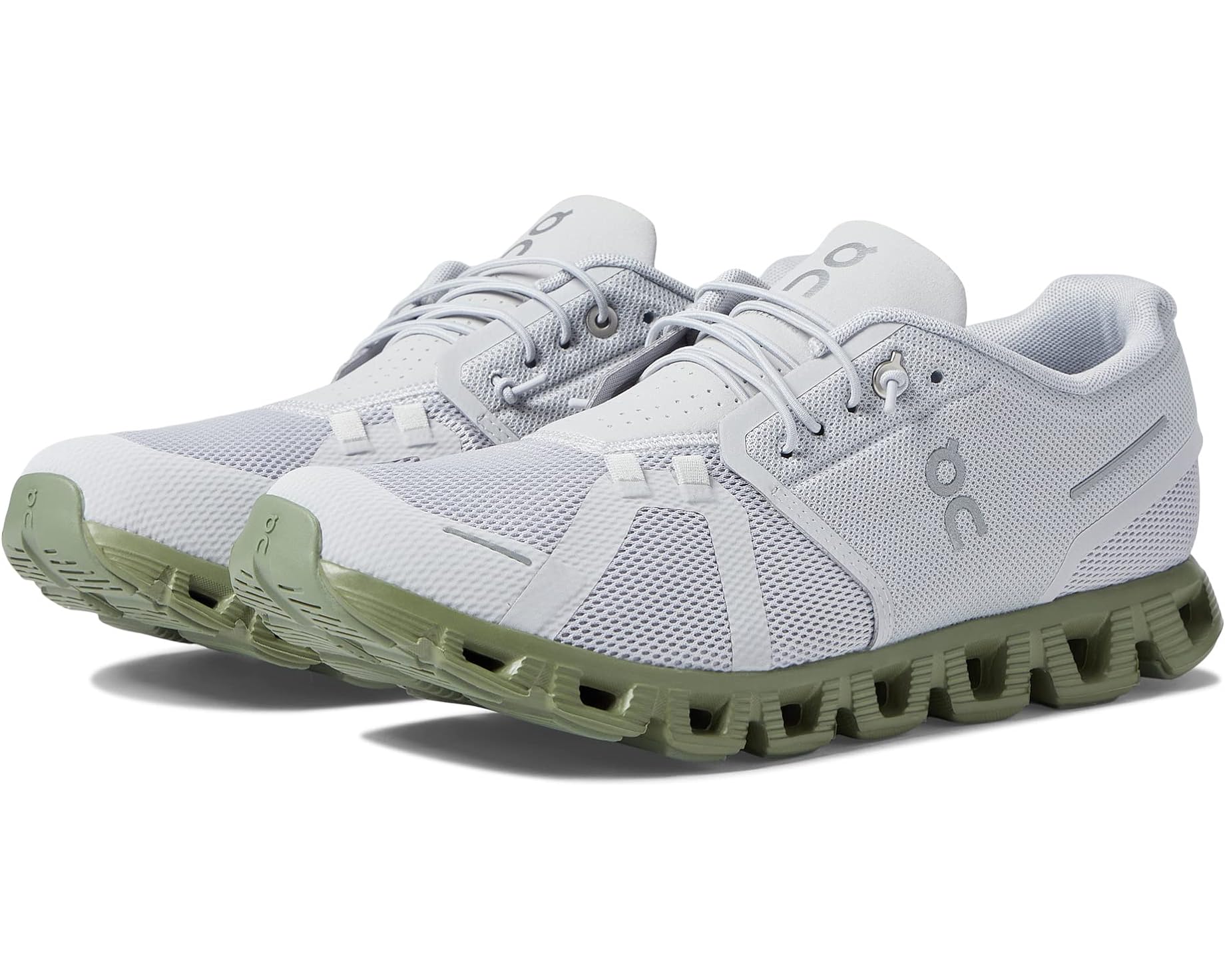 A pair of white running shoes with light green soles.