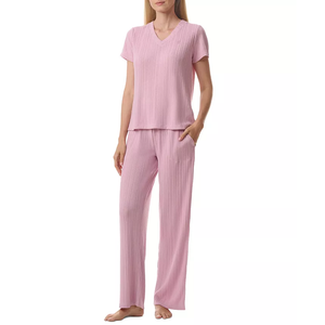A pink two-piece pajama set featuring a short-sleeved, V-neck top and full-length pants with a relaxed fit.