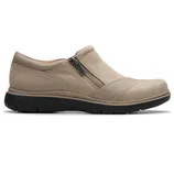 Beige slip-on shoe with a decorative side zipper and a robust black rubber sole.