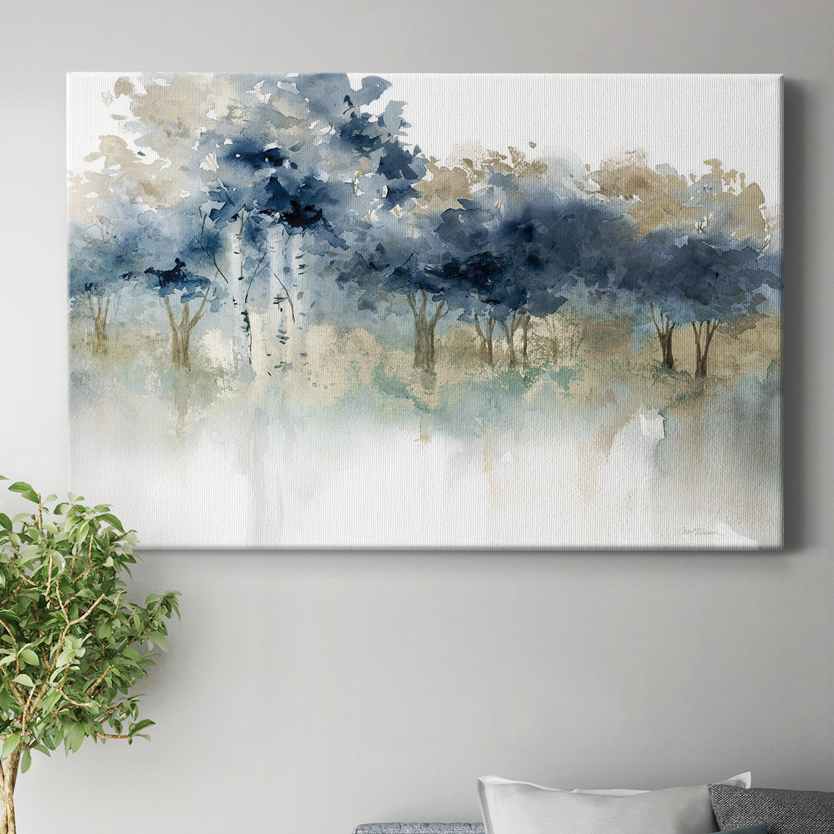 A 36\“ x 24\“ canvas wall art depicting a serene, abstract landscape of trees with blue and beige hues, conveying a tranquil, misty atmosphere.