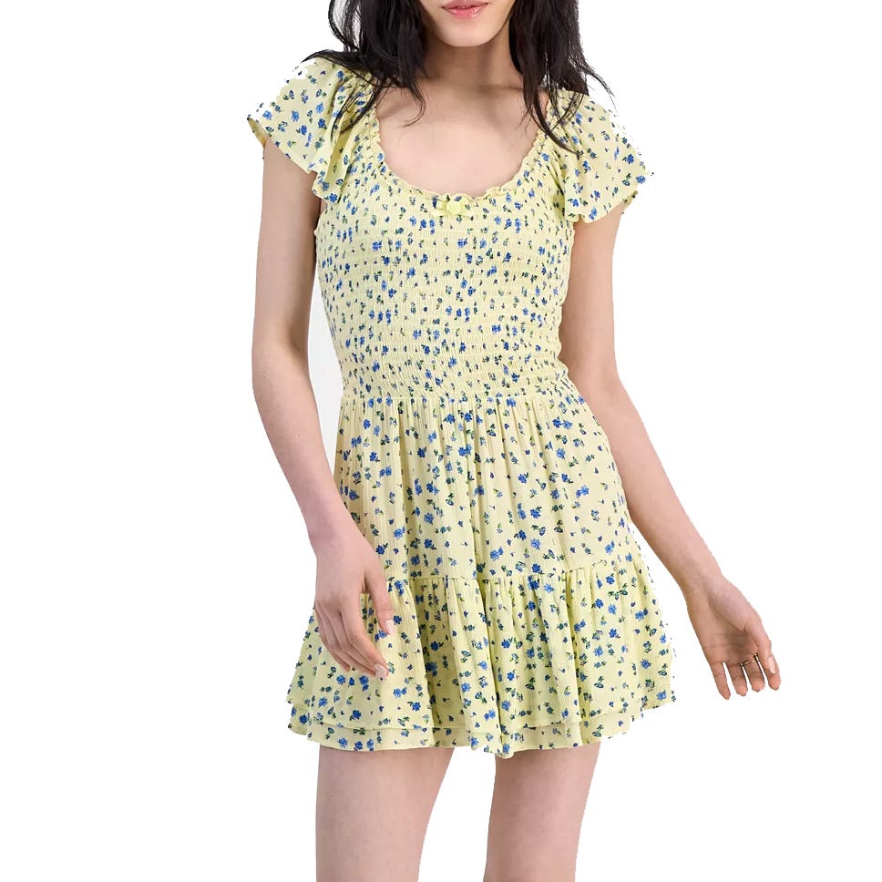 A yellow dress with blue floral print, featuring a smocked bodice, cap sleeves, and a tiered skirt.