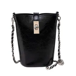 A black leather bucket bag with a chain strap and decorative lock detail.