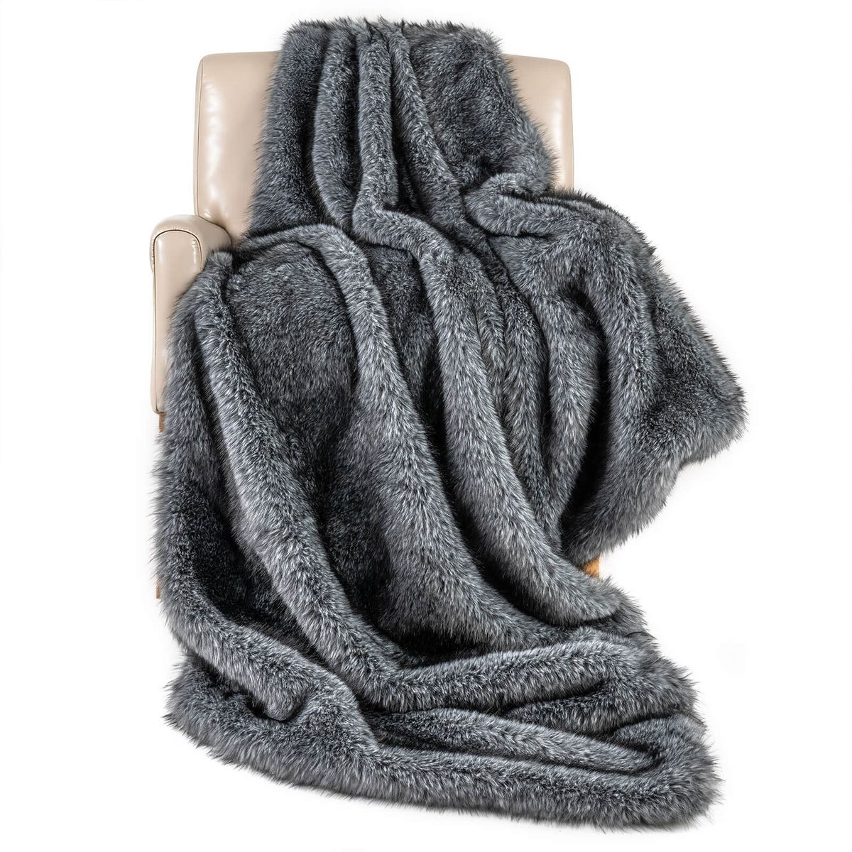 A plush gray faux fur blanket draped over a beige chair, showcasing its soft and luxurious texture.