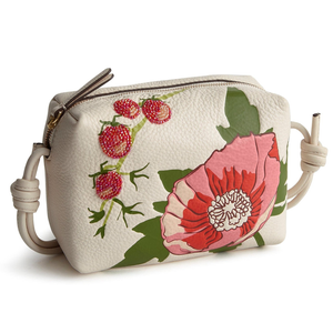 Vera Bradley Embellished Leather Bag features a white background with decorative pink and red floral designs, bead embellishments, and knotted side handles.