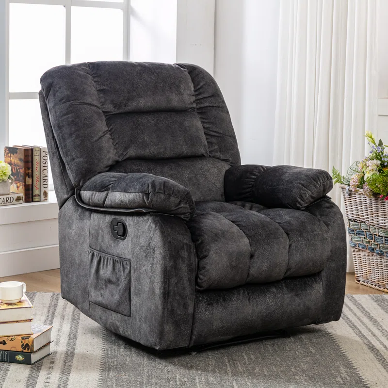 A plush gray recliner with padded armrests and a side pocket.