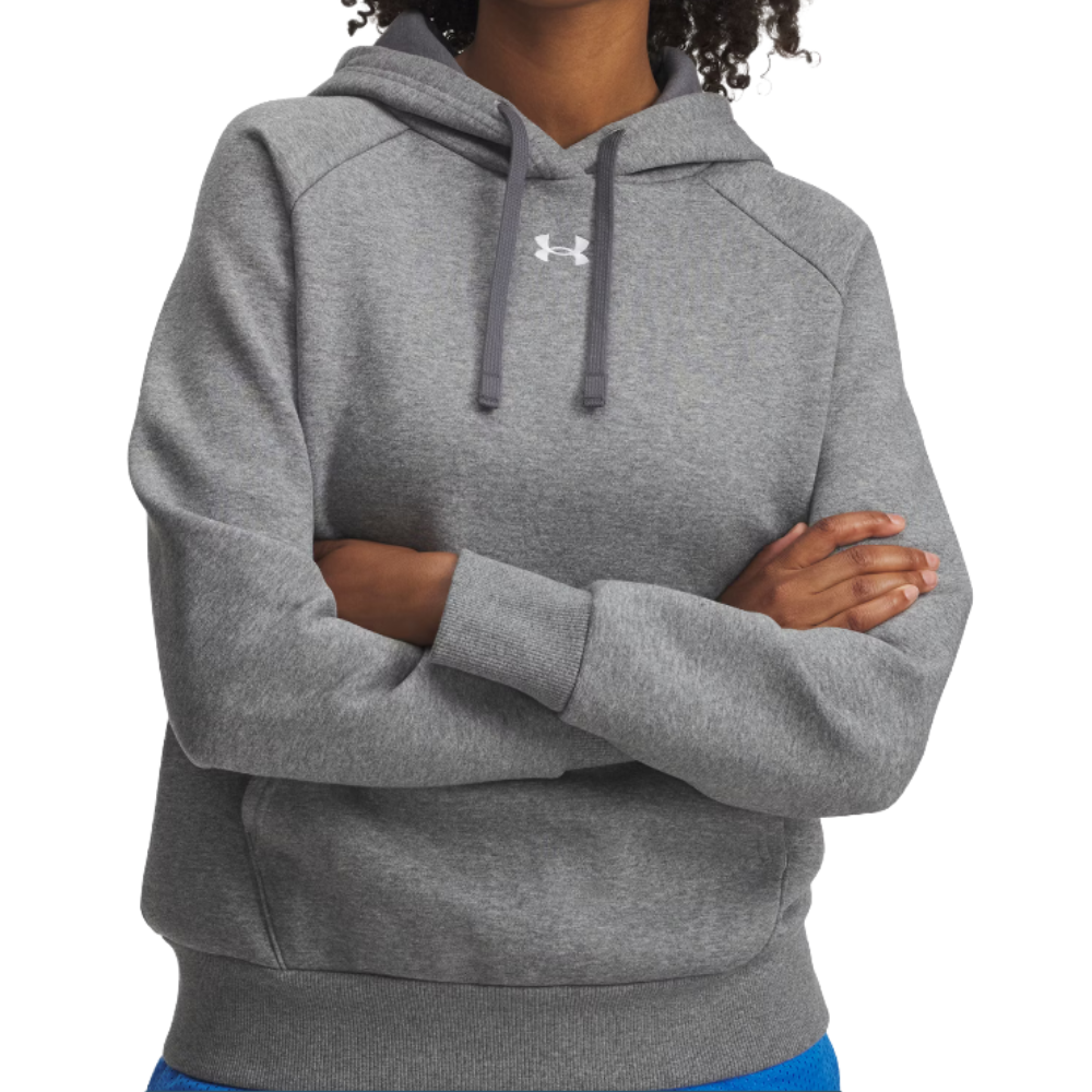 A person is wearing a gray Under Armour hoodie with the logo on the chest, featuring a drawstring hood and ribbed cuffs.
