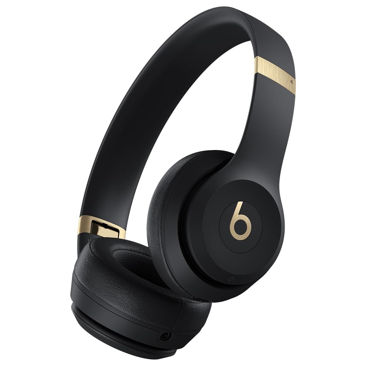 Black over-ear wireless headphones with gold accents, featuring the signature \“b\“ logo.