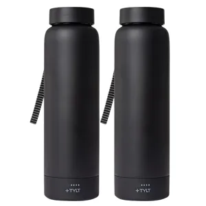 Two black water bottles with a strap and a base featuring a \“+\“ TYLT logo and charging indicators.