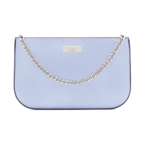 A light blue handbag featuring a silver chain strap and a metal logo plaque on the front.