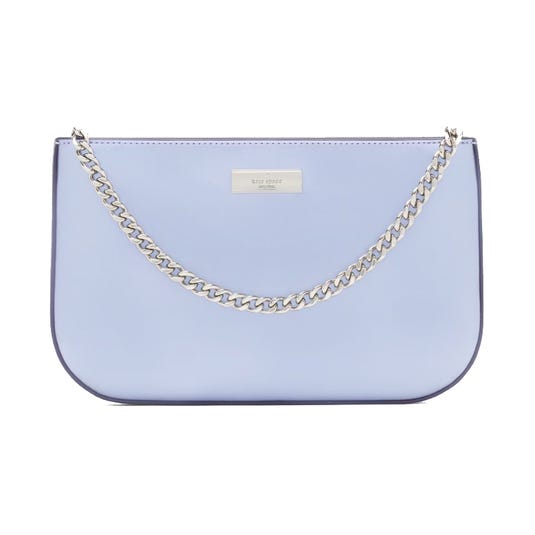 A light blue handbag featuring a silver chain strap and a metal logo plaque on the front.