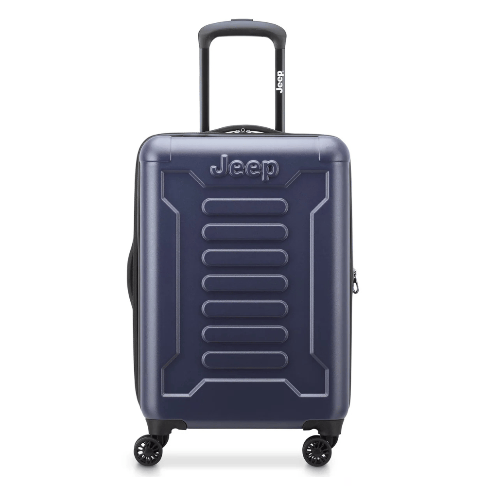 A navy blue hard-shell suitcase with four spinner wheels, featuring a Jeep logo and an extendable handle.