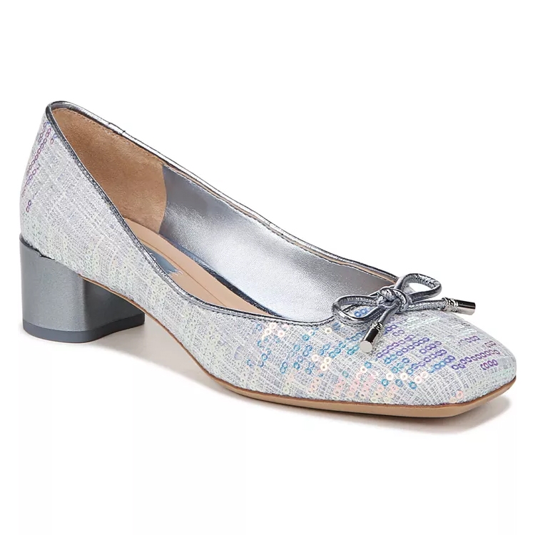 A silver, low-heeled shoe with a colorful sequin overlay and a bow detail on the toe.