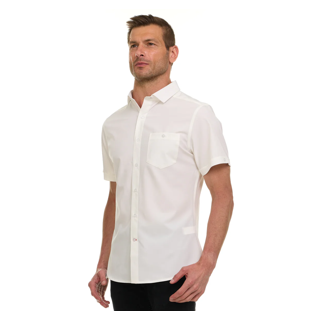 A man is wearing a short-sleeve white button-up shirt with a front pocket.
