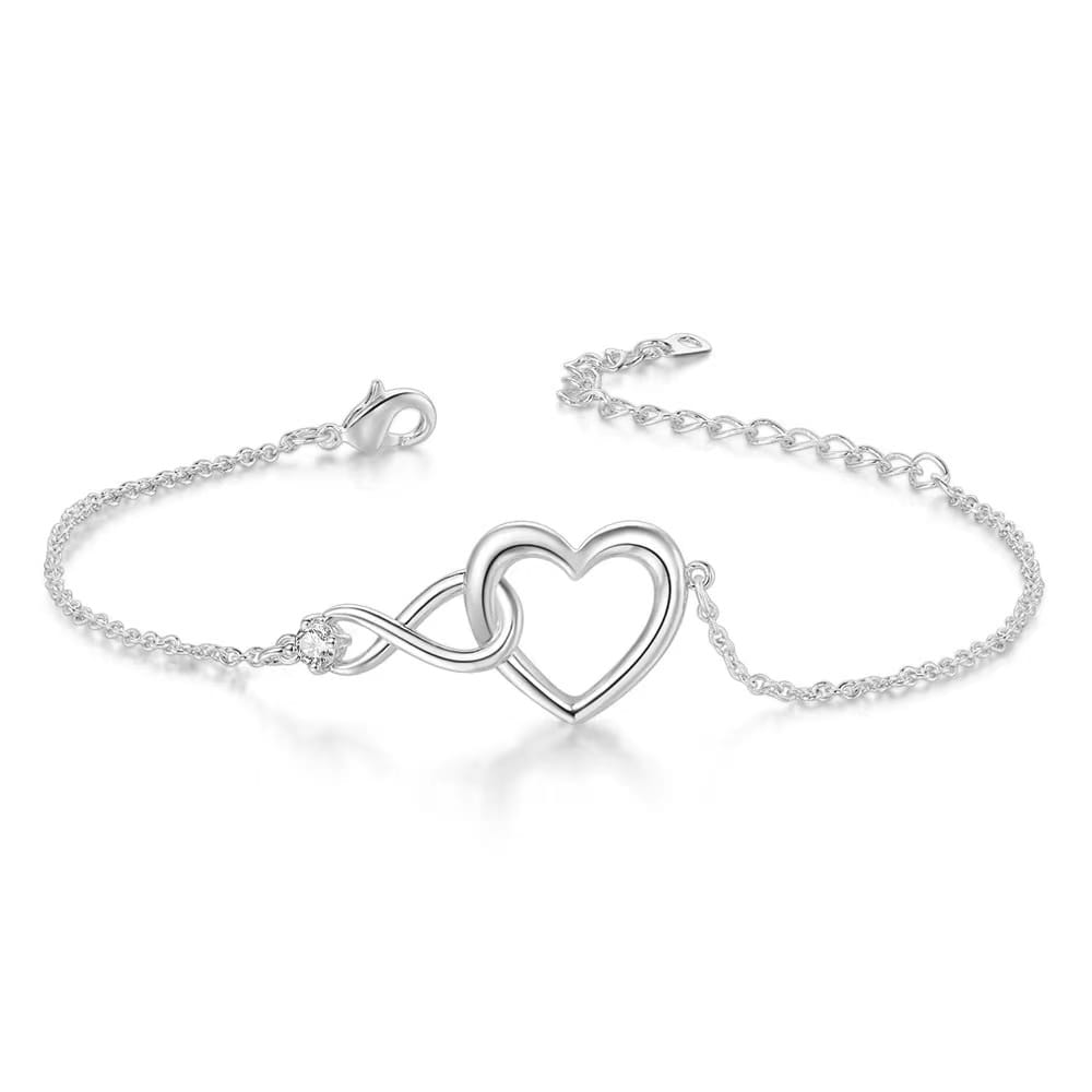 Silver bracelet with interlinked heart design.