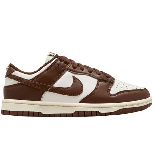 A brown and white Nike Dunk Low sneaker with a leather upper, brown Swoosh, laces, and outsole.