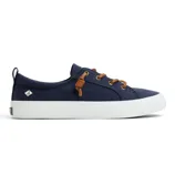A navy canvas sneaker with white soles, featuring brown leather laces and a small logo on the side.