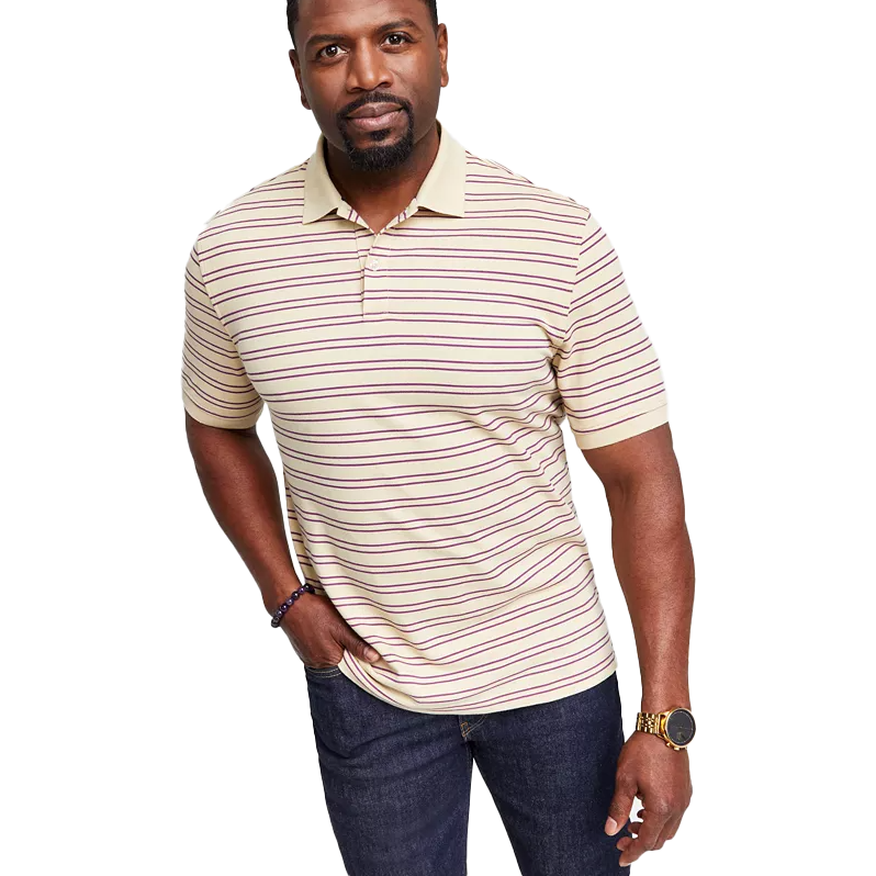 A men's Club Room polo shirt featuring beige and maroon stripes, short sleeves, and a classic collar, paired with dark jeans.