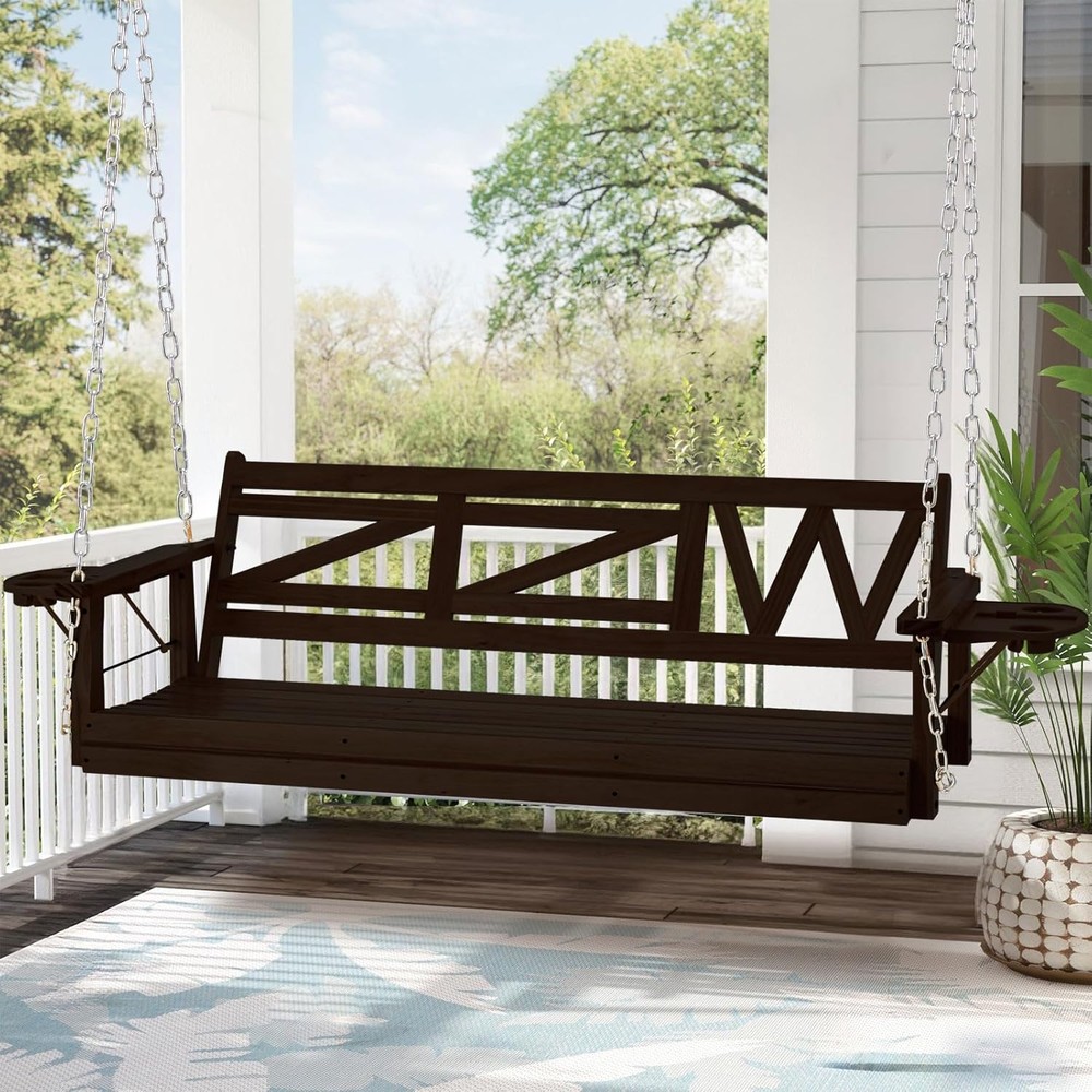 Wooden porch swing with a geometric backrest, suspended by metal chains on a covered patio.