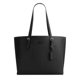Black Coach tote bag with adjustable shoulder straps, embossed logo, and attached tag.