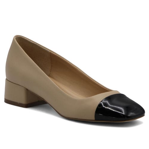 Beige slip-on shoe with a low block heel and a black patent leather cap toe, offering a classic and elegant design.